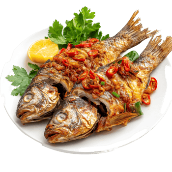 Delicious fried fish topped with chili and spices served with lemon and fresh herbs, Fried fish with chilli and spices, delicious food Thailand style on transparent background png