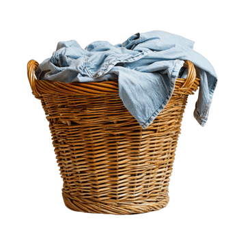 A woven laundry basket filled with clean clothes ready for folding. png