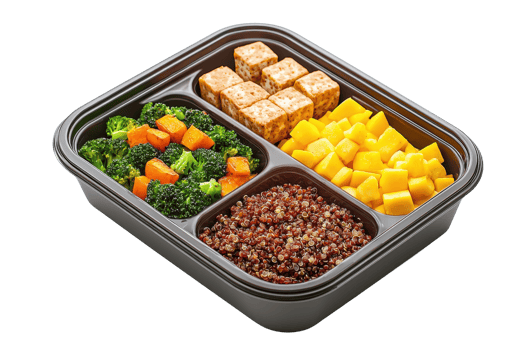 A meal prep container filled with colorful vegetables, tofu, quinoa, and mango, showcasing a healthy and balanced food selection. png