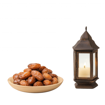 A bowl of dates next to a candle lantern, creating an inviting ambiance. png