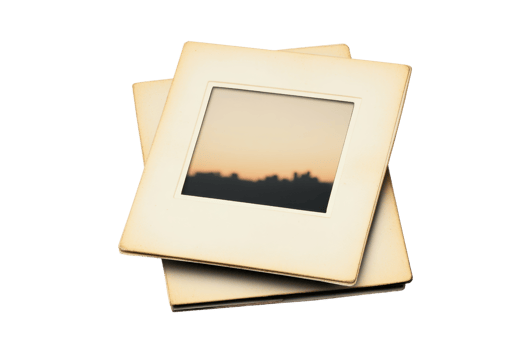 Vintage photo slides with a blurred image of a sunset in the background. Ideal for nostalgia and retro-themed projects. png
