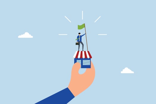 Small business idea, successful entrepreneur waving victory flag in a small shop held by a gigantic hand. vector