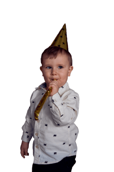 a toddler in a party cap blows the whistle flute png