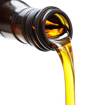 Golden oil pours from a dark bottle against a black background png
