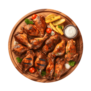 grilled chicken wings on a wooden board with vegetables and sauce png