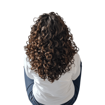 Woman with curly hair sits thoughtfully on a minimalist background wearing a transparent top, Back View of Woman Sitting with Curly Hair on transparent background png