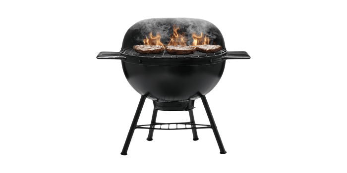 Black charcoal grill with steaks on fire isolated on transparent background png