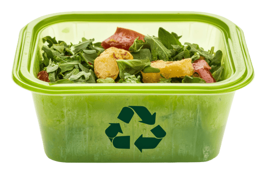 Fresh salad in a recyclable container on display png