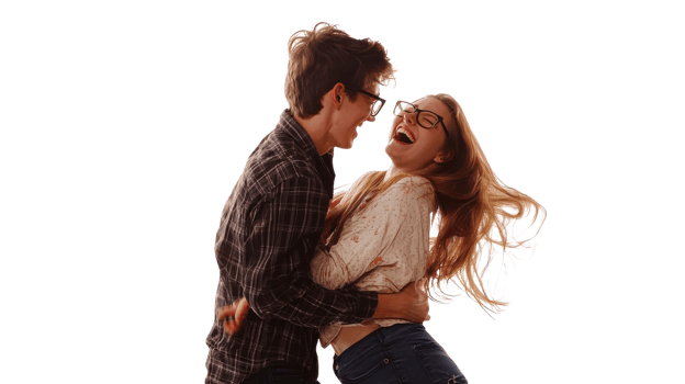Couple joyfully laughing together during a fun indoor moment captured in bright light png