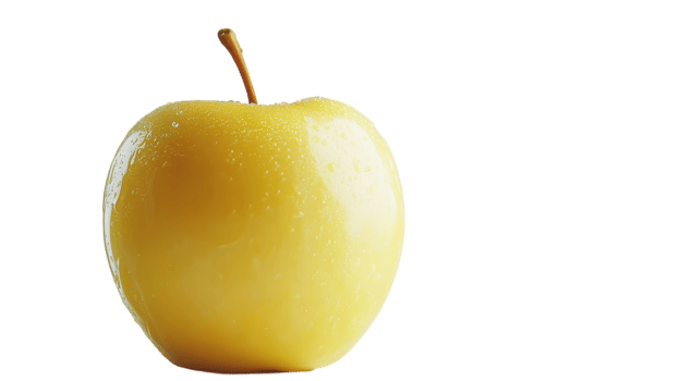 Fresh yellow apple standing upright on a clean white surface with water droplets visible png