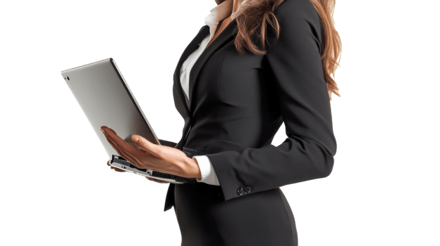 Business professional working on a laptop while standing, dressed in formal attire with a sleek black suit png