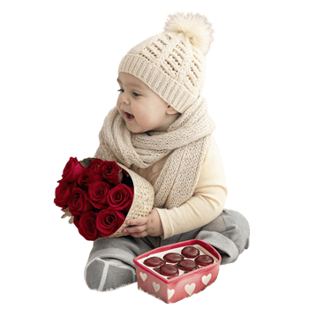 baby in knit hat holding tin gift with ribbon details png