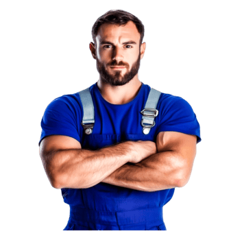 Confident Worker in Blue Overalls with Arms Crossed at Workplace png