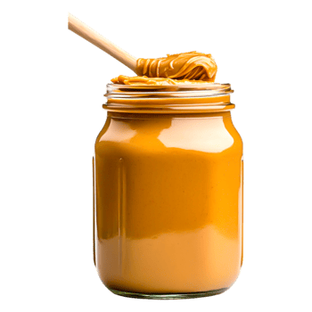 Creamy Peanut Butter in Glass Jar with Spoon on Wooden Surface png