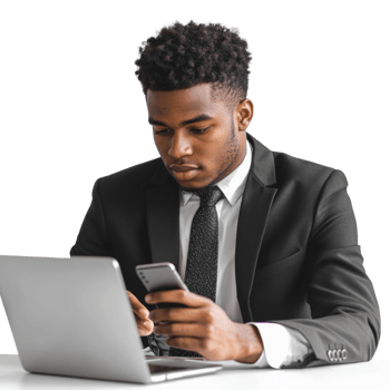 Businessman Using Laptop and Smartphone at Desk png
