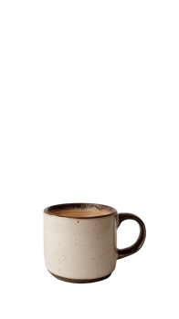 A speckled mug contains a creamy coffee beverage png