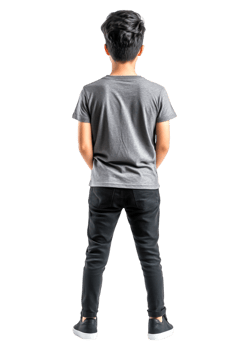 Young Boy Standing with Hands Behind Back in Black Pants and Gray Shirt png