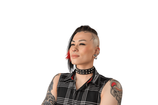 Confident Non Binary Individual Embracing Bold Alternative Fashion with Edgy Hairstyle and Tattoos png