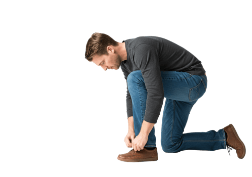 Man Kneeling Tying Shoelaces Casual Jeans Brown Shoes Pose Male Style Adult Model Image Photo Black png