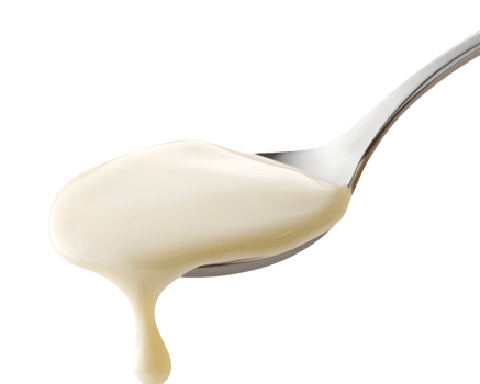 Creamy White Sauce Dripping from Spoon on Transparent Background png