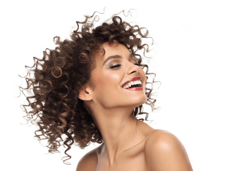 Curly haired woman smiling with confidence png