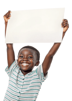 Smiling child holds blank sign with joy indoors png