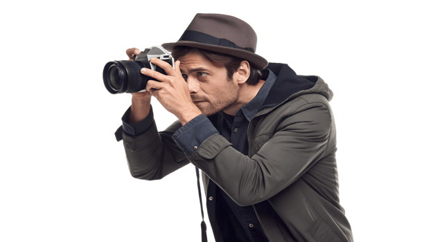 Man taking photographs with a camera indoors png