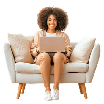 Smiling woman sitting on a cozy couch using a laptop png