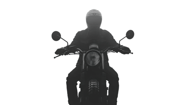 Motorcycle rider in silhouette during a foggy early morning png