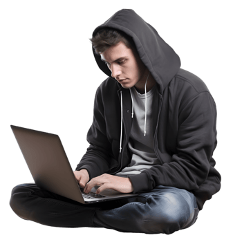Young man in hoodie typing on laptop cozy indoor setting digital workspace focused environment close-up perspective png