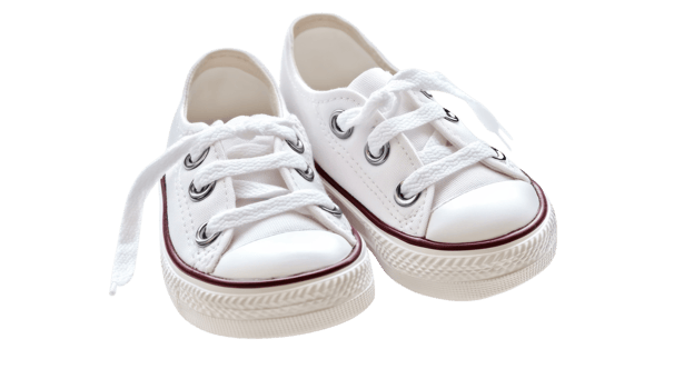 Fresh white canvas sneakers displayed on a clean surface, showcasing their classic style and design for casual wear png