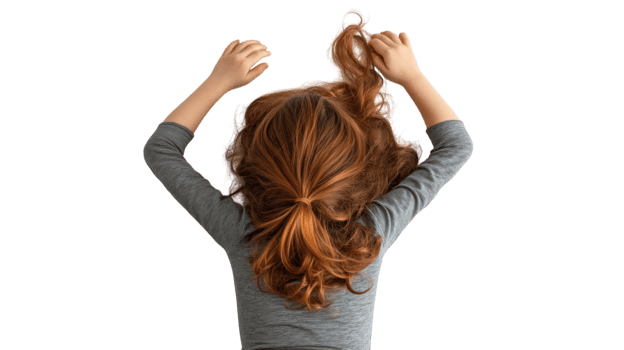 Child with long, wavy hair playing with curls in a light setting during afternoon png