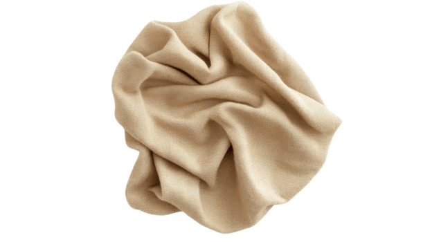 Soft beige fabric draped elegantly on a white background showcasing texture and warmth png