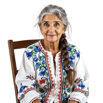 An older woman sitting in a chair with a white shirt and blue and white embroidered blouse png