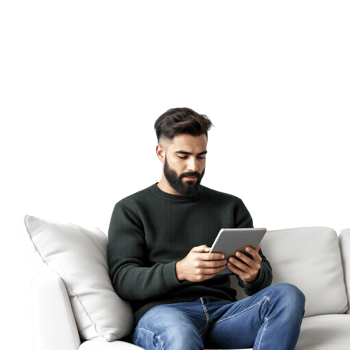 A man sitting on a couch with a tablet computer png