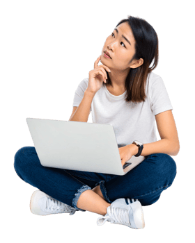 Young woman thinking while working on a laptop with a thoughtful expression indoors png