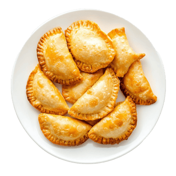 Plate of golden empanas with a flaky crust png