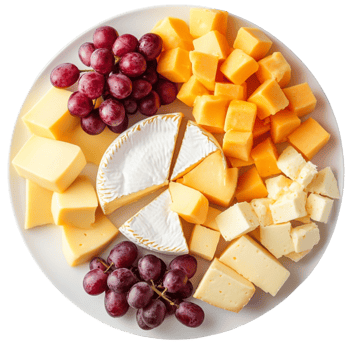 White plate with assorted cheeses and red grapes png