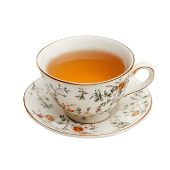 Elegant tea cup with floral design and golden rim sits on a matching saucer, filled with warm amber liquid against a bright transparent background, cool tea cup on transparent backgroundfile png
