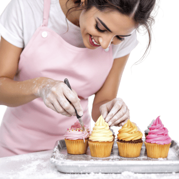A woman in an apron is making cupcakes png