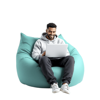A man sitting on a bean bag chair with a laptop png