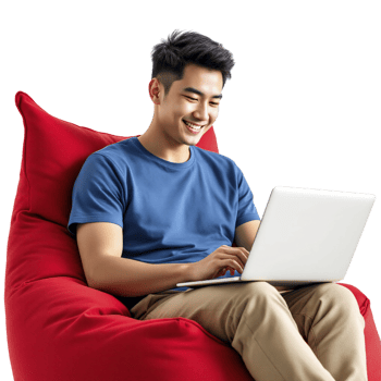 A man sitting on a bean bag chair with a laptop png