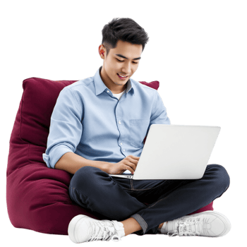 Young man sitting on bean bag chair with laptop png