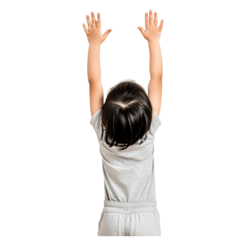 Child Reaching Upwards with Joy in a Bright Room Setting png