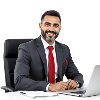 A man in a suit and tie sitting at a desk with a laptop png