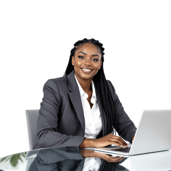 A smiling black woman in a business suit sitting at a table with a laptop png