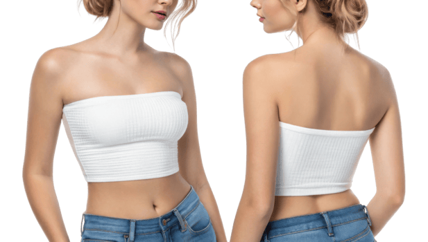 This features woman wearing white strapless top and blue jeans, showcasing stylish and casual look png