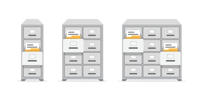Three filing cabinets with files on top vector