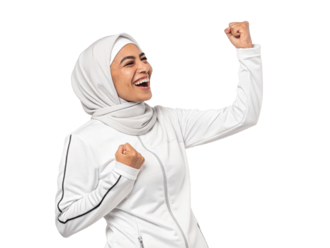 joyful woman in white jacket and hijab celebrating success with raised fists png