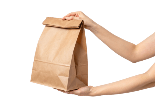 person holding brown paper bag with folded top, ideal for takeout or lunch png